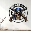 Pirate skull metal wall sign displayed on a white paneled wall above a console table