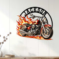 Red motorcycle metal wall sign displayed as biker decor on a light paneled wall