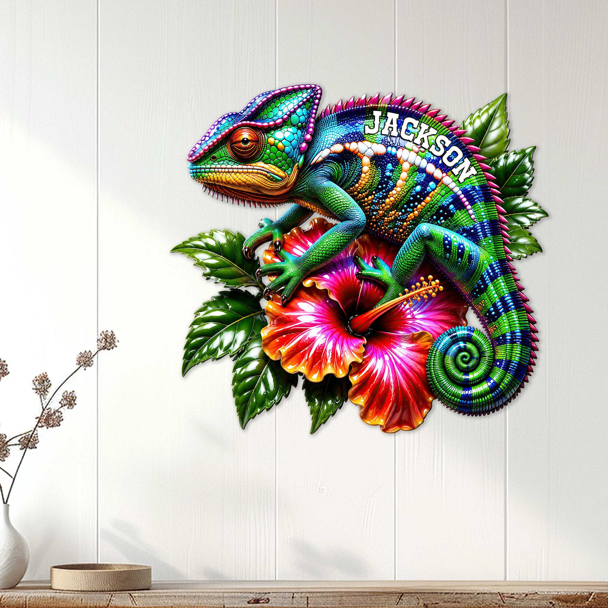 Chameleon metal wall sign displayed on a light wood-paneled wall above a console table