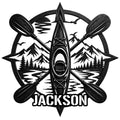 Custom kayak metal sign featuring crossed paddles, mountain scenery, pine trees, and a winding lake