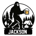 Custom Bigfoot metal sign featuring a forest scene, campfire, tent, and raised beer mug