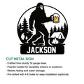 Bigfoot cut metal sign product graphic showing a camping scene with pine trees, tent, fire, and beer mug