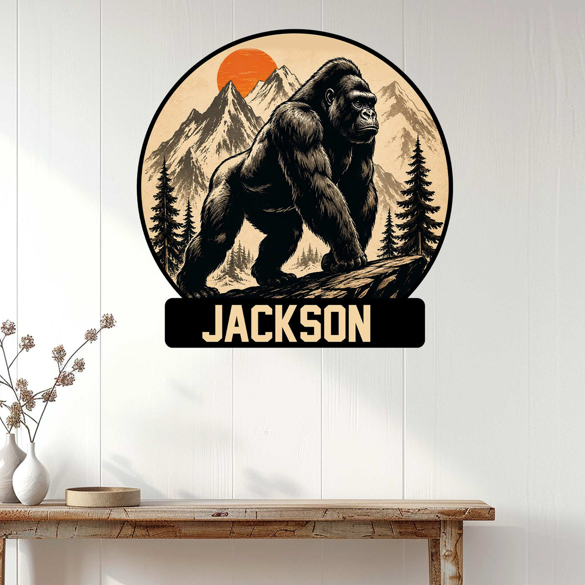 Gorilla wall sign displayed on a white wood-paneled wall above a rustic console table