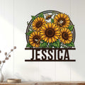 Sunflower floral metal sign displayed on a white paneled wall above a wooden console