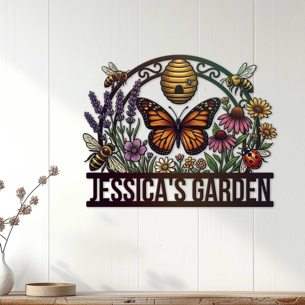 Pollinator garden metal sign displayed on a white paneled wall with colorful flowers, bees, and butterfly artwork