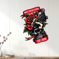 Tattoo studio wall decor displayed on white paneling, featuring a skull, rose, and tattoo machine