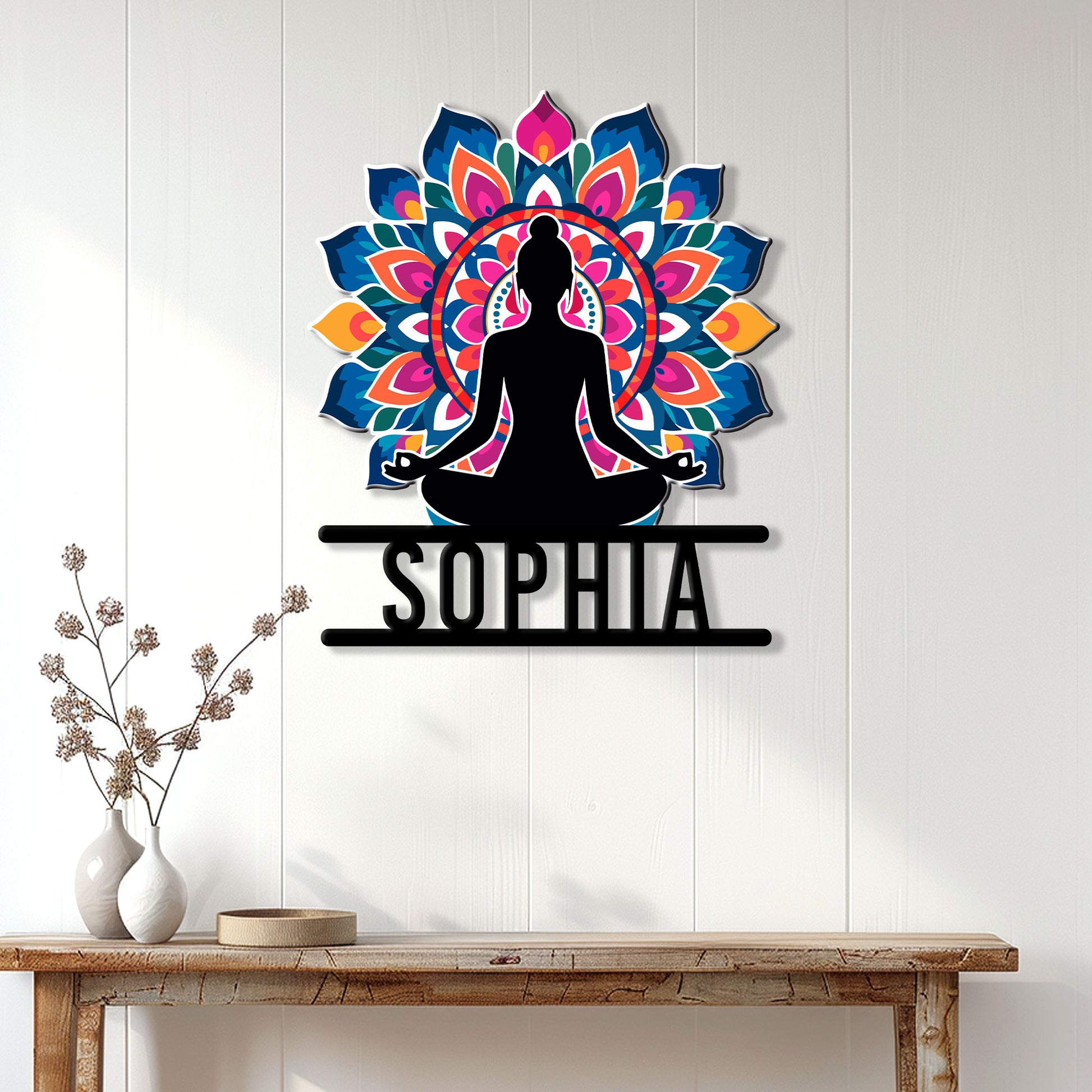 Colorful meditation yoga wall sign displayed on a light wood-paneled wall above a console table
