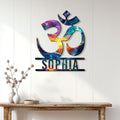 Vibrant Om meditation wall sign displayed on a bright paneled wall above a console table