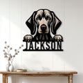 Weimaraner dog metal sign displayed on a light paneled wall above a console table