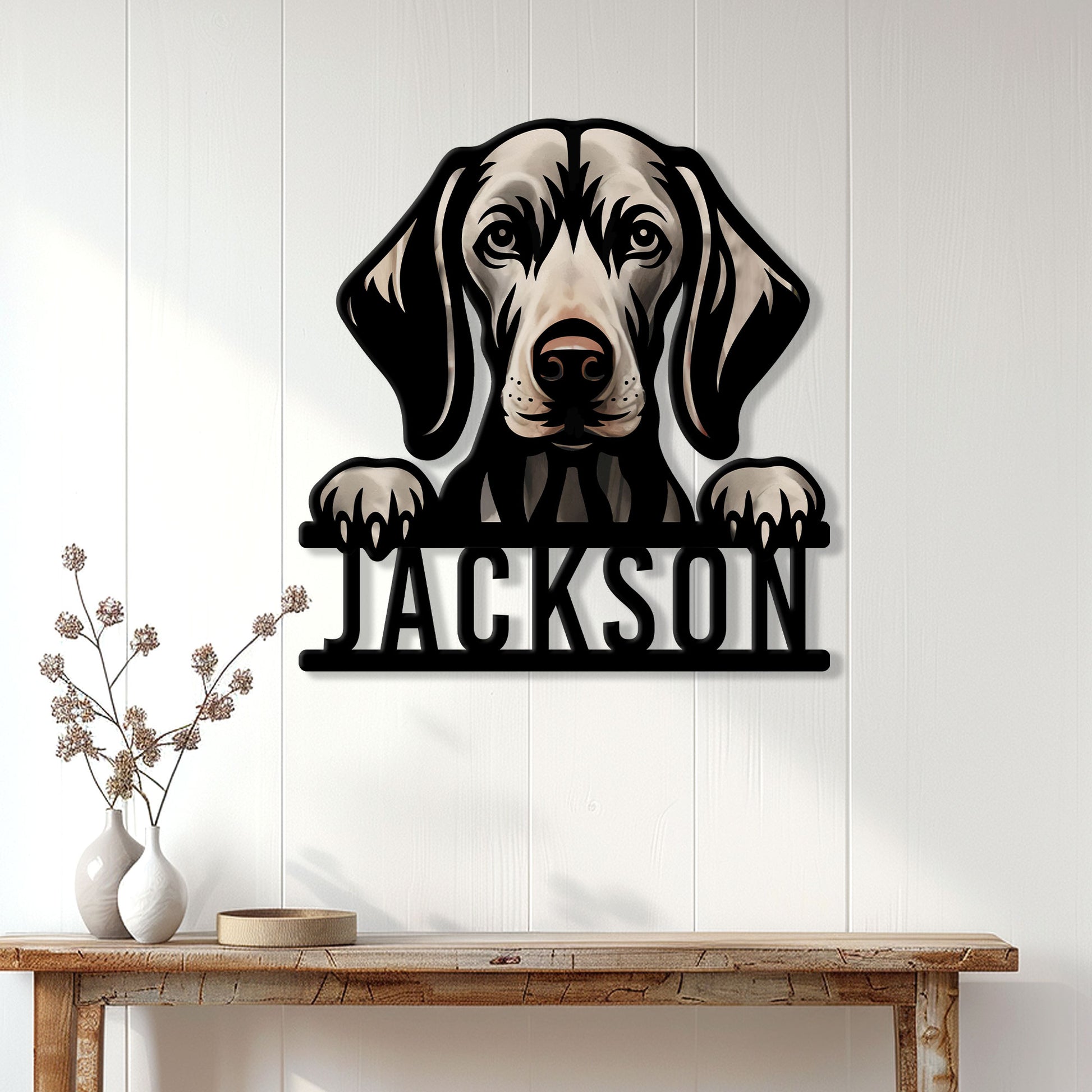 Weimaraner dog metal sign displayed on a light paneled wall above a console table