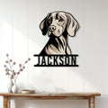 Weimaraner metal wall sign displayed on a light paneled wall above a rustic entryway table