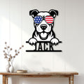 American Staffordshire Terrier metal sign displayed on a light wood-paneled wall above a console table