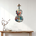 Floral violin wall sign displayed on a light wood-paneled wall above a console table