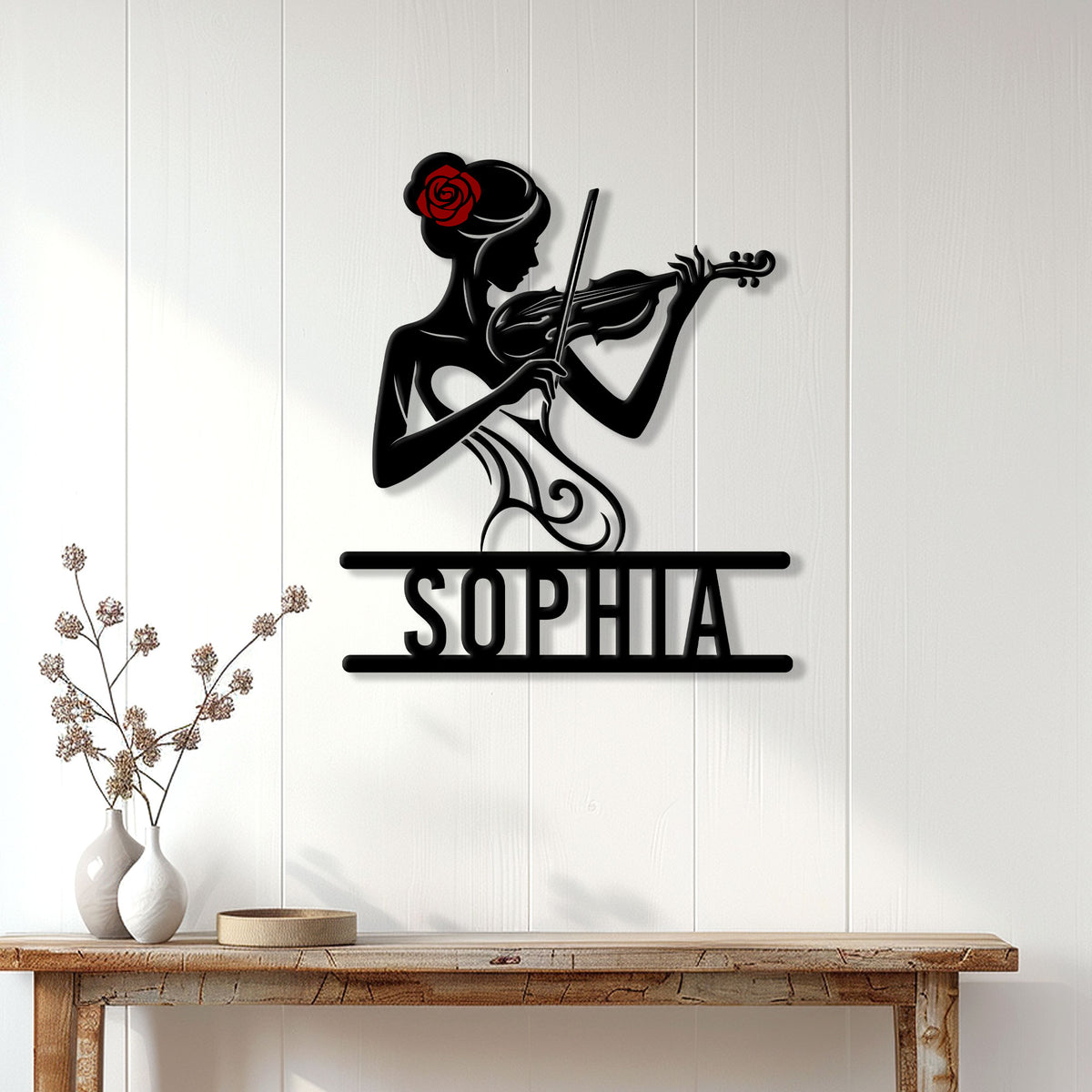 Violinist metal wall sign displayed on a white paneled wall above a console table