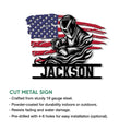 Patriotic cut metal sign showcasing a welder in protective gear with an American flag backdrop