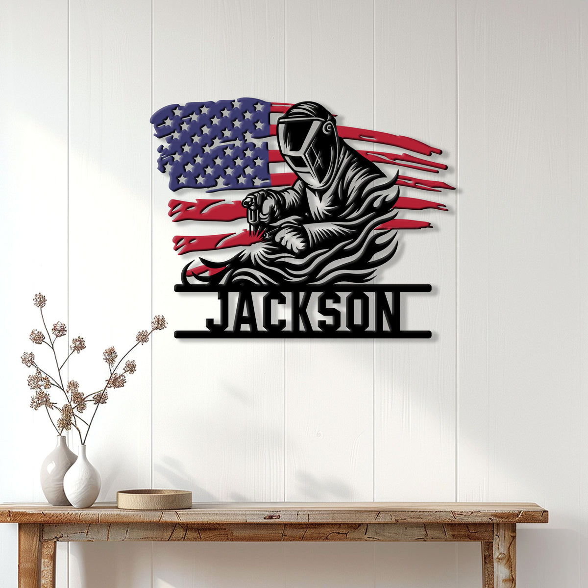 Welder wall decor displayed on a light wood-paneled wall above a console table