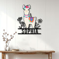 Colorful alpaca wall sign displayed on a bright wood-paneled entryway wall