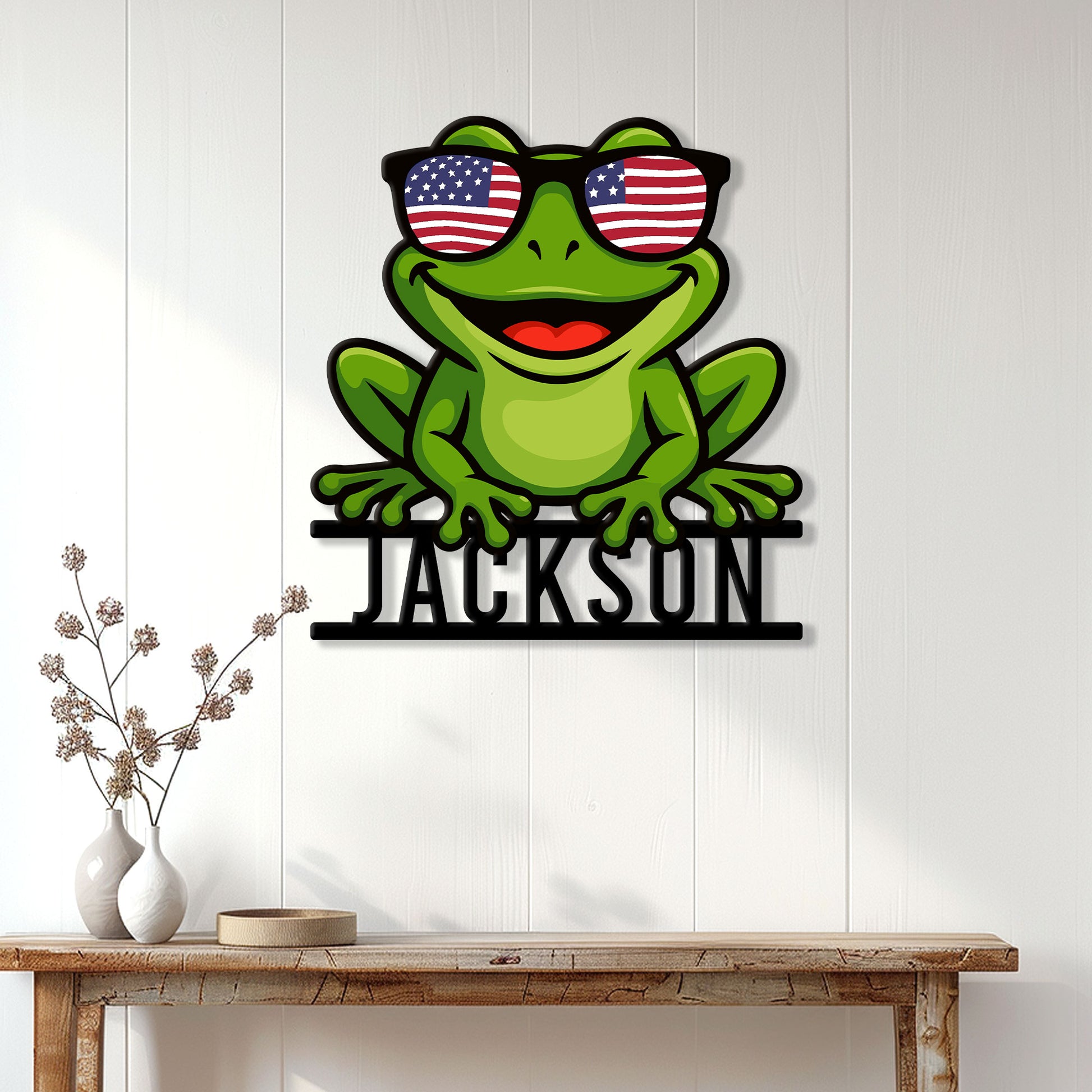 Frog metal wall sign displayed on a bright paneled wall above a console table