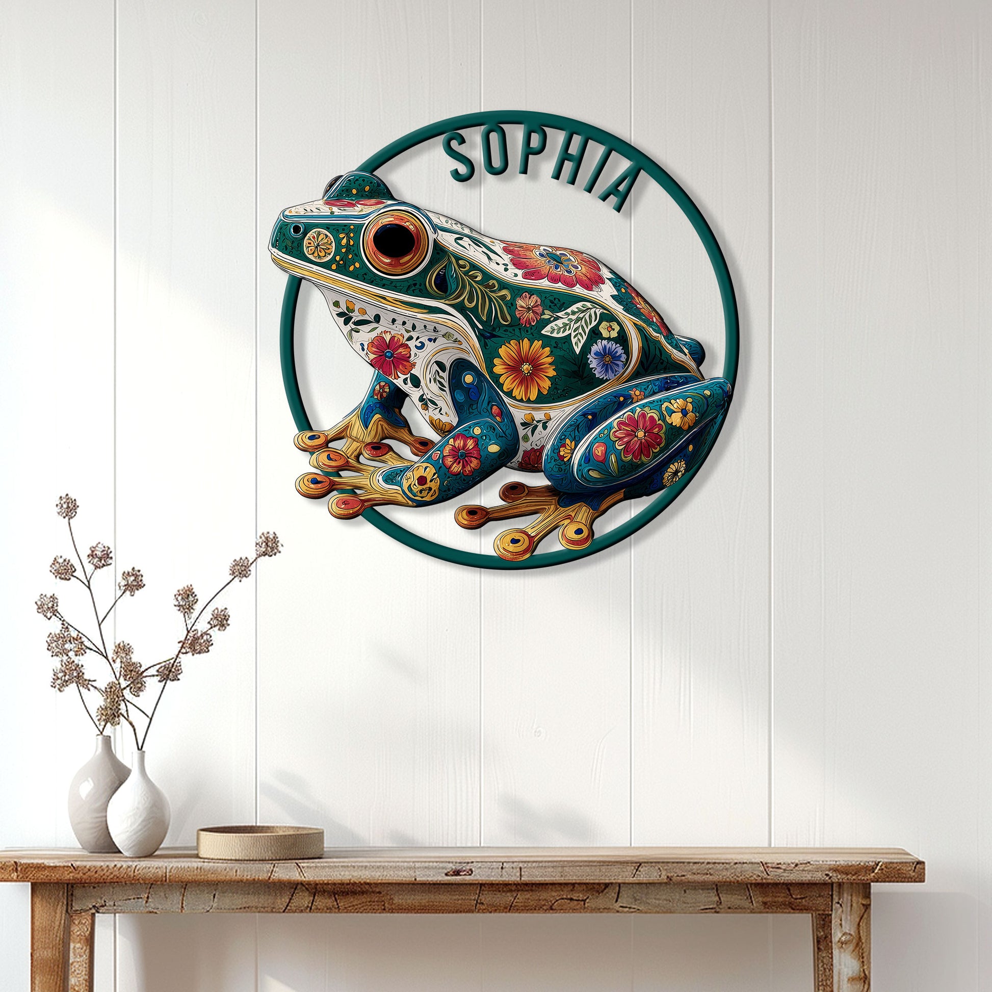 Floral frog metal wall sign displayed on a bright paneled entryway wall