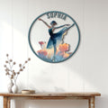 Round ballet wall sign displayed above a console table in a bright, modern home interior