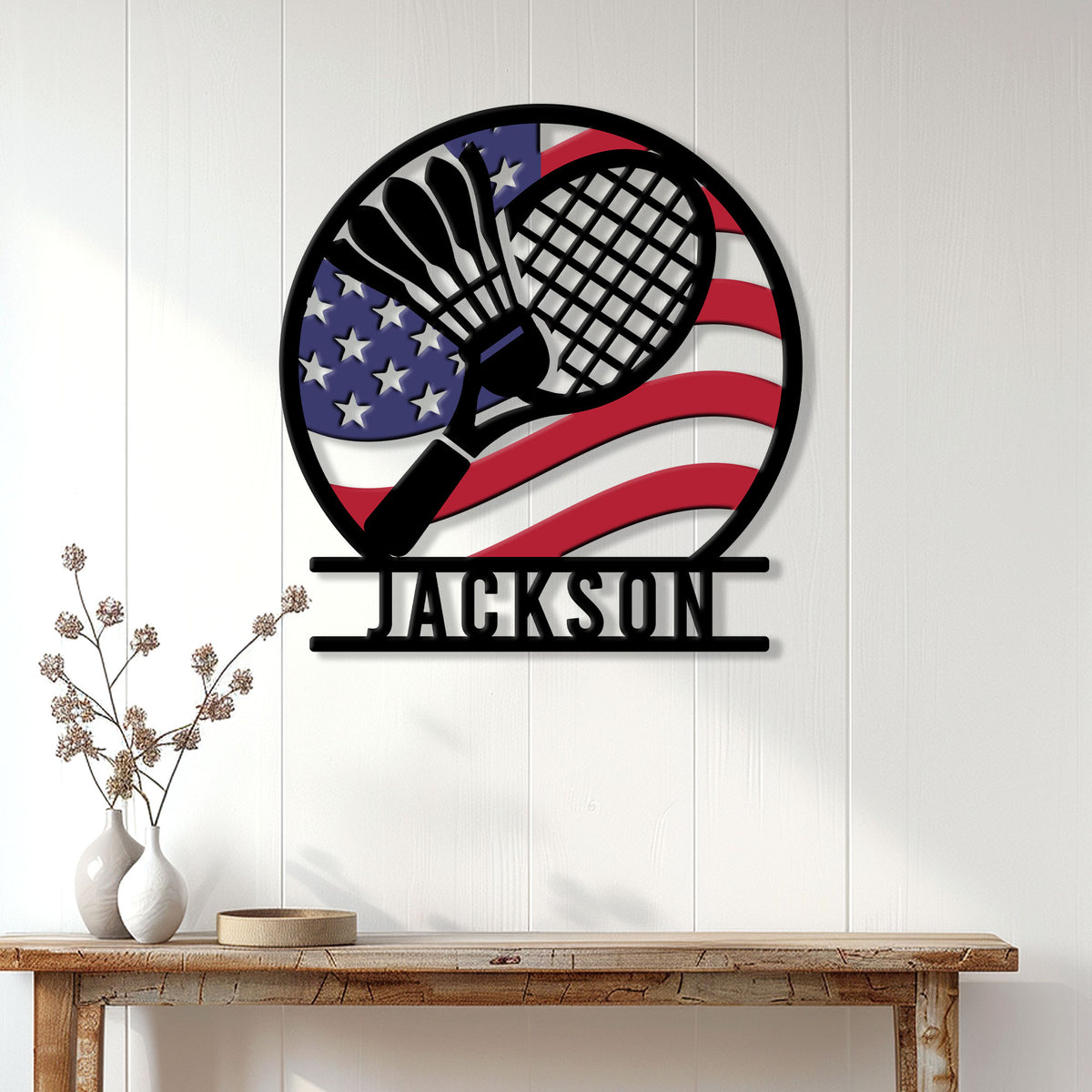 Badminton wall decor displayed above a console table with crossed rackets and a patriotic flag design