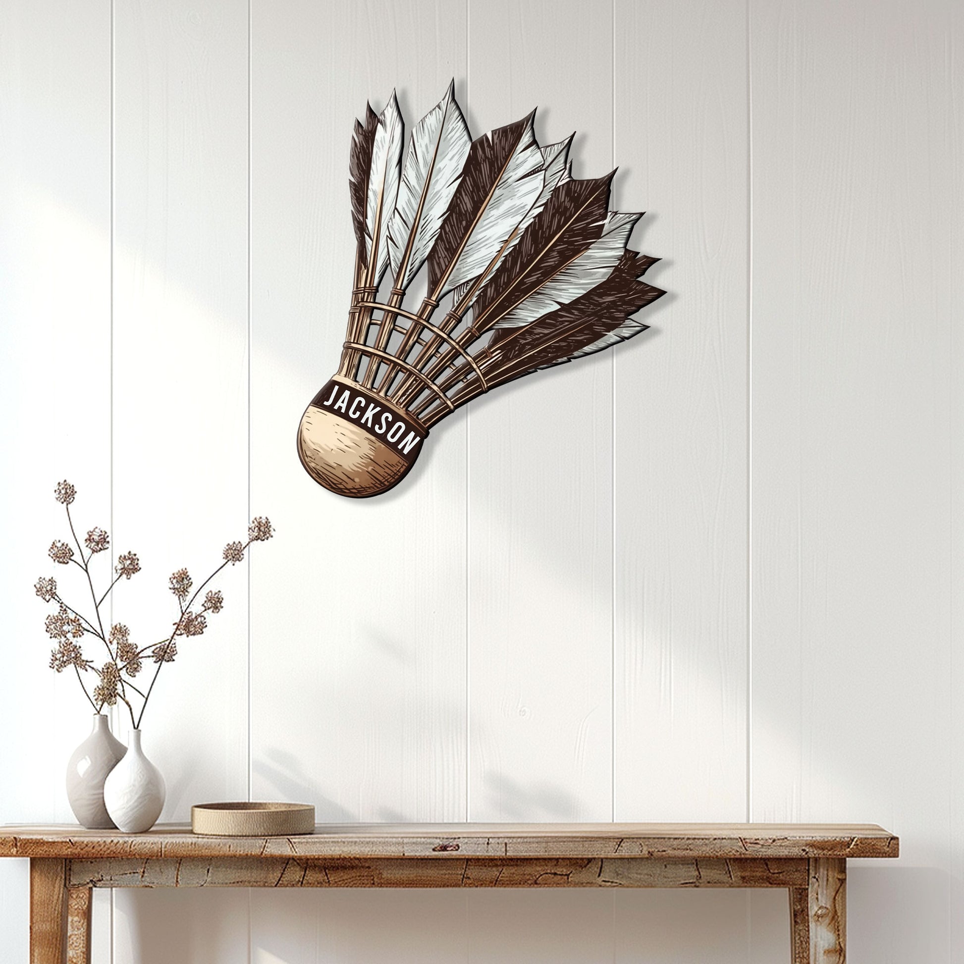 Badminton shuttlecock wall sign displayed above a console table in a bright modern home