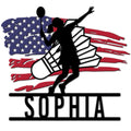 Badminton metal sign featuring a dynamic player silhouette, racket, shuttlecock, and distressed American flag design