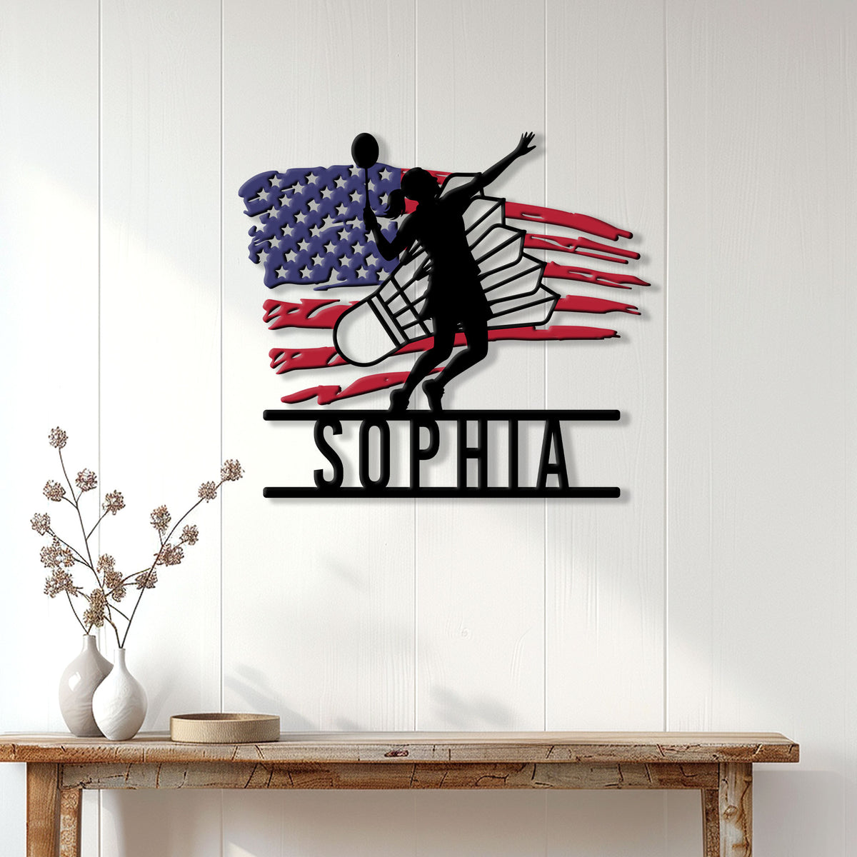 Badminton wall sign displayed on a white paneled wall above a rustic console table