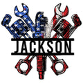 Mechanic metal sign featuring crossed wrenches, pistons, a spark plug, and bold patriotic colors