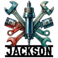 Colorful mechanic metal sign featuring crossed wrenches, pistons, and a central spark plug
