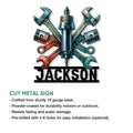 Mechanic garage sign shown with crossed automotive tools, pistons, spark plug, and cut metal sign details