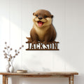 Custom otter metal sign displayed on a white paneled wall above a wooden console table