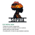 African heritage metal sign shown with a woman’s profile, glowing savanna sunset, wildlife silhouettes, and bold base lettering