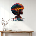 African-inspired tree of life metal sign displayed as colorful wall decor in a bright home