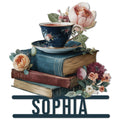 Book lover metal sign featuring stacked books, a floral teacup, roses, and elegant botanical details