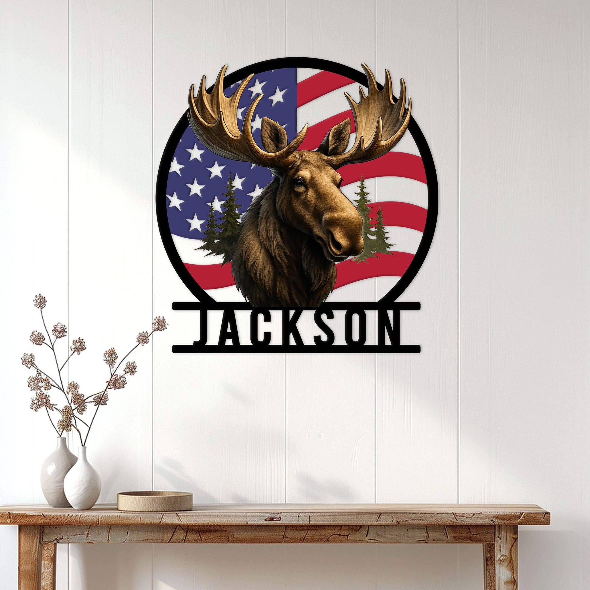 Patriotic moose wall sign displayed on a light wood-paneled wall above a rustic entryway table