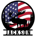 Custom moose metal sign featuring a bold moose silhouette, pine trees, and an American flag backdrop