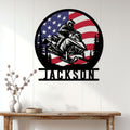 Snowmobile metal wall decor displayed in a home entryway with a bold rider and patriotic outdoor theme