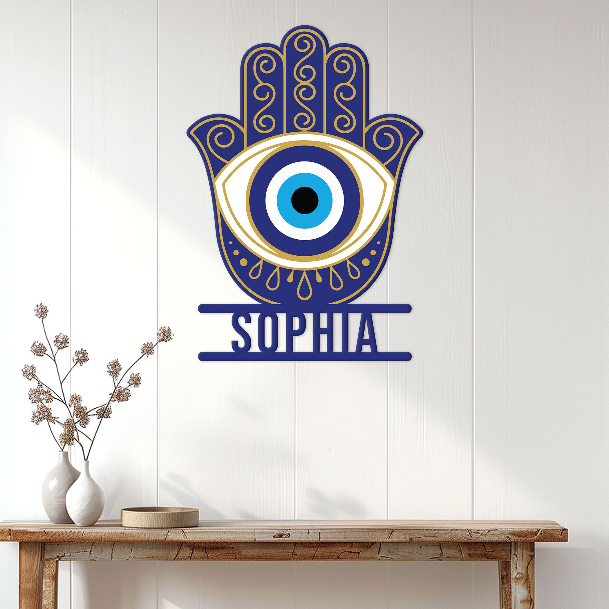 Evil Eye Hamsa hand wall sign displayed above a console table in a bright contemporary home