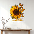 Sunflower and butterfly metal wall sign styled on a bright white paneled wall