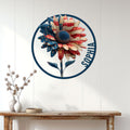 Patriotic sunflower wall sign displayed on a white paneled wall above a console table