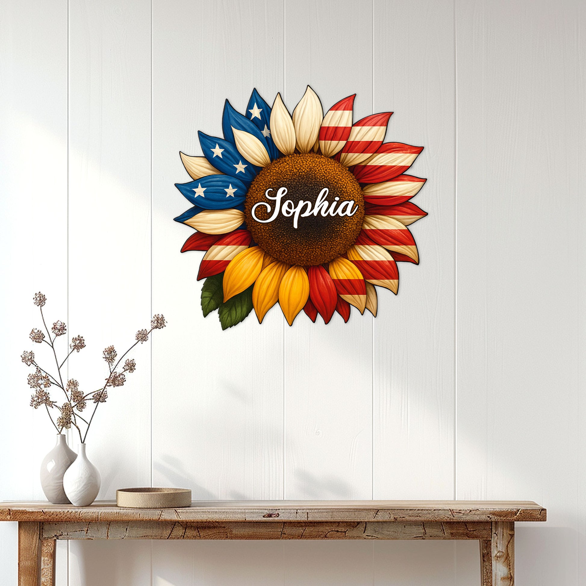 Patriotic sunflower wall sign displayed on a bright white entryway wall above a console table