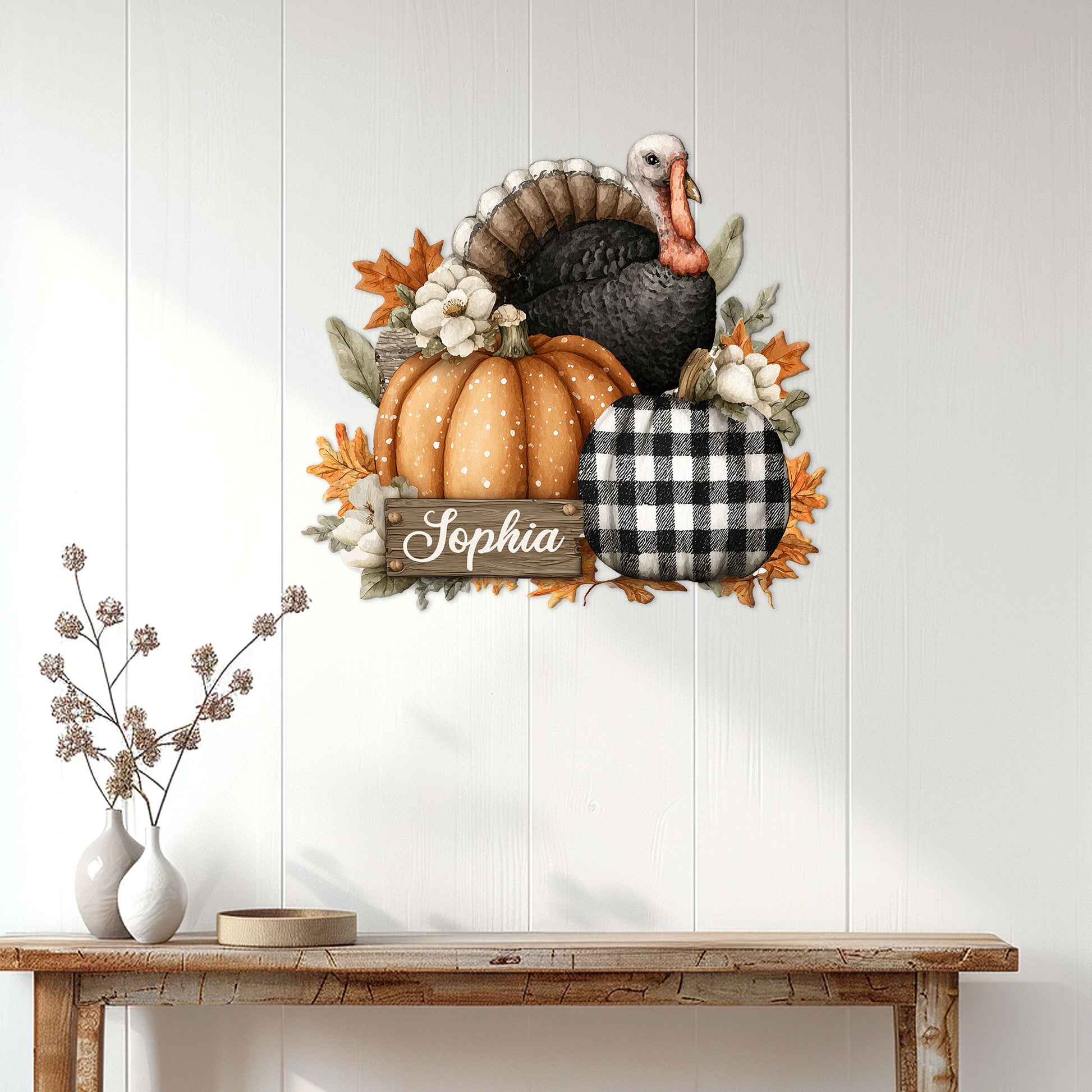 Thanksgiving turkey wall decor displayed on a white paneled entryway above a wooden console