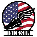 Patriotic running metal sign featuring a winged black running shoe over an American flag design