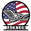 Patriotic running shoe metal sign featuring a bold American flag design and circular black frame