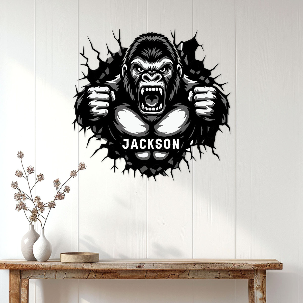 Roaring gorilla wall sign displayed above a console table in a modern home entryway