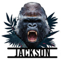 Roaring low-poly gorilla metal sign with bold silhouette and decorative tropical leaves