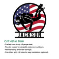 Cut metal scuba diving sign featuring a diver silhouette against a bold American flag design