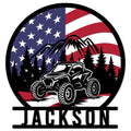 Custom ATV metal sign featuring an off-road quad in a mountain forest beneath an American flag