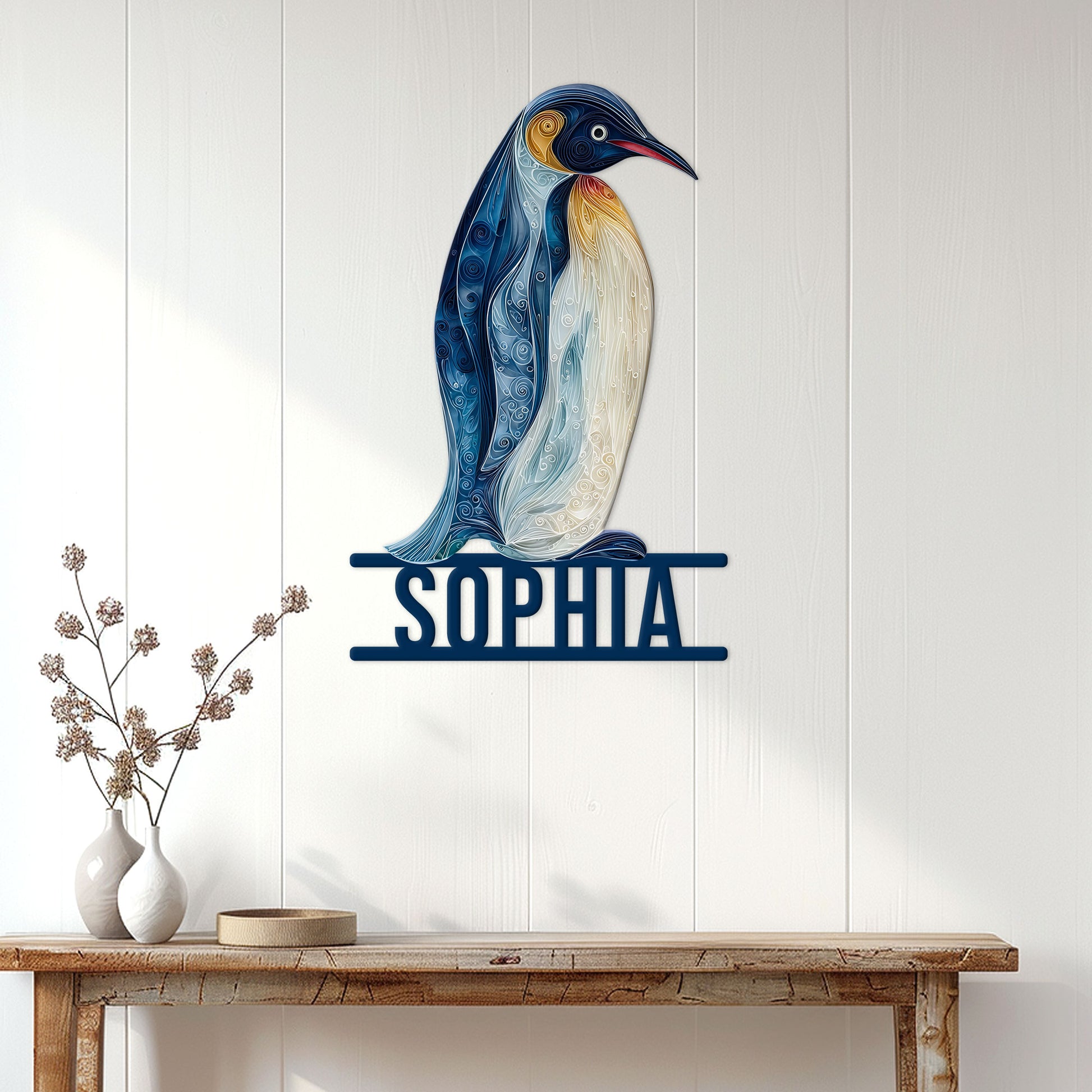 Blue and gold penguin metal sign displayed on a white paneled wall above a console table